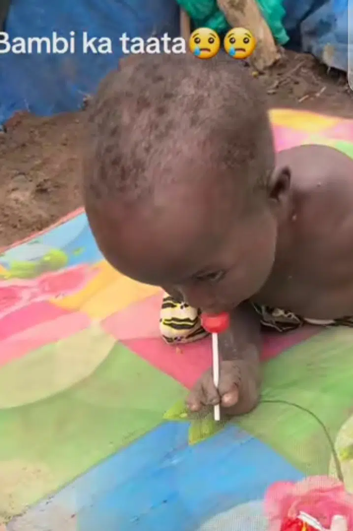 Physically challenged little boy stirs reactions as he joyfully licks a lollipop (Video)