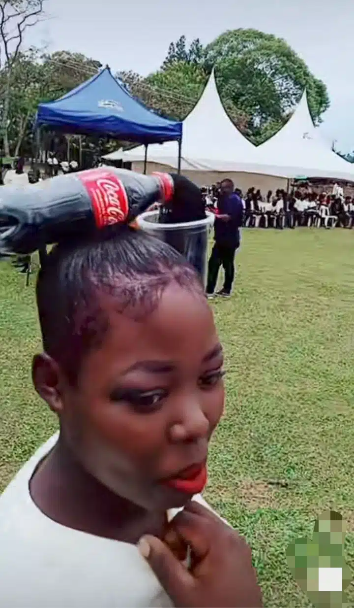 “Creativity that dazzles” – Young lady flaunts Coca-cola-inspired hairstyle [Video]